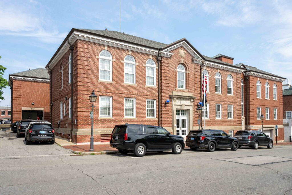 Cruiser cars in front of the police headquarters.