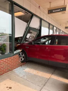 Red SUV crashed through the brick facade and door of a dental office